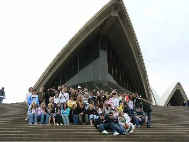 Archbishop Sentamu Academy students sitting on the steps in front of the Sydney Opera House on a school trip organised by Teen Resilience Coach, Hayley Buchan.