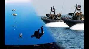 Two military boats in water with a person falling or jumping into the water and helicopters flying overhead.