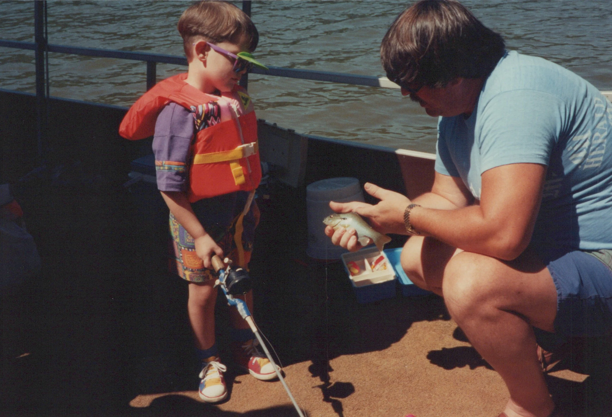 An old photo of Craig as a child learning to fish with his grandfather on the Potomac River