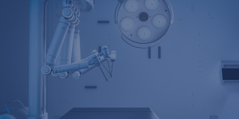 A surgical operating room with a robotic surgical arm and overhead surgical light