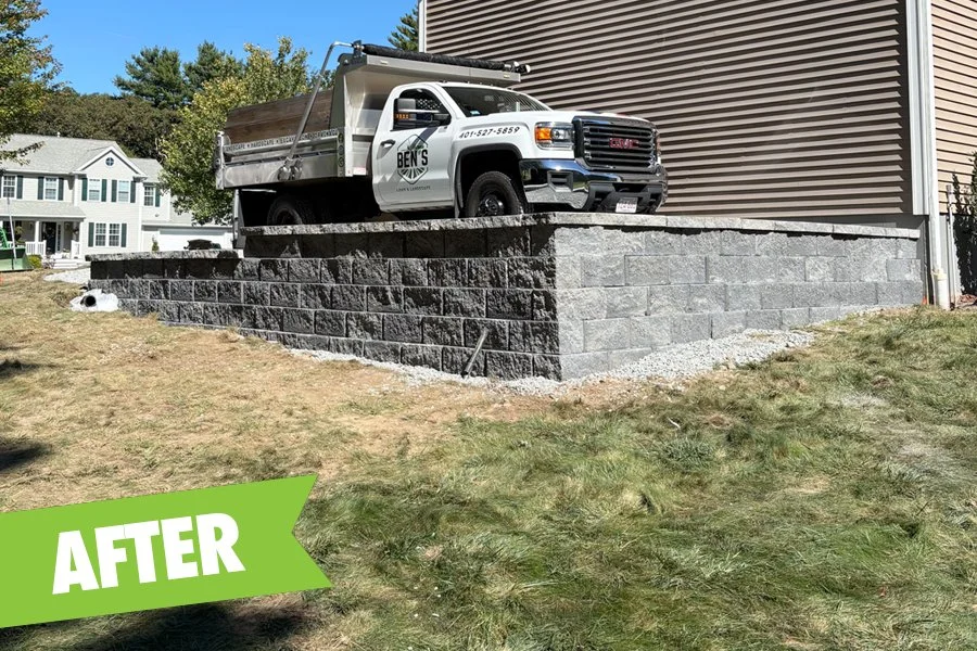 Retaining wall installed, prepped driveway for asphalt and installed proper drainage.