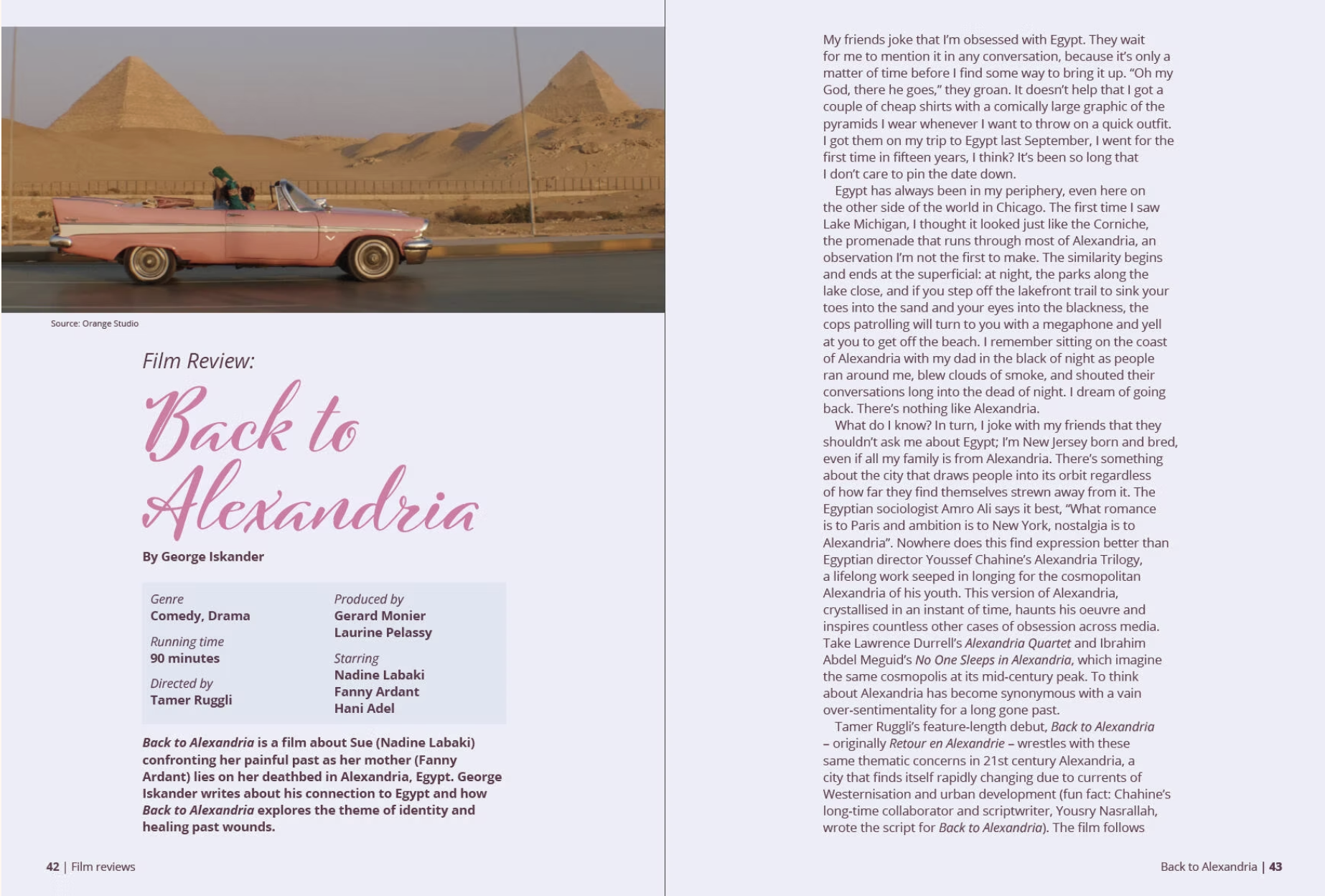 A pink vintage convertible car driving along a highway with the pyramids of Giza in the background, set against a desert landscape.
