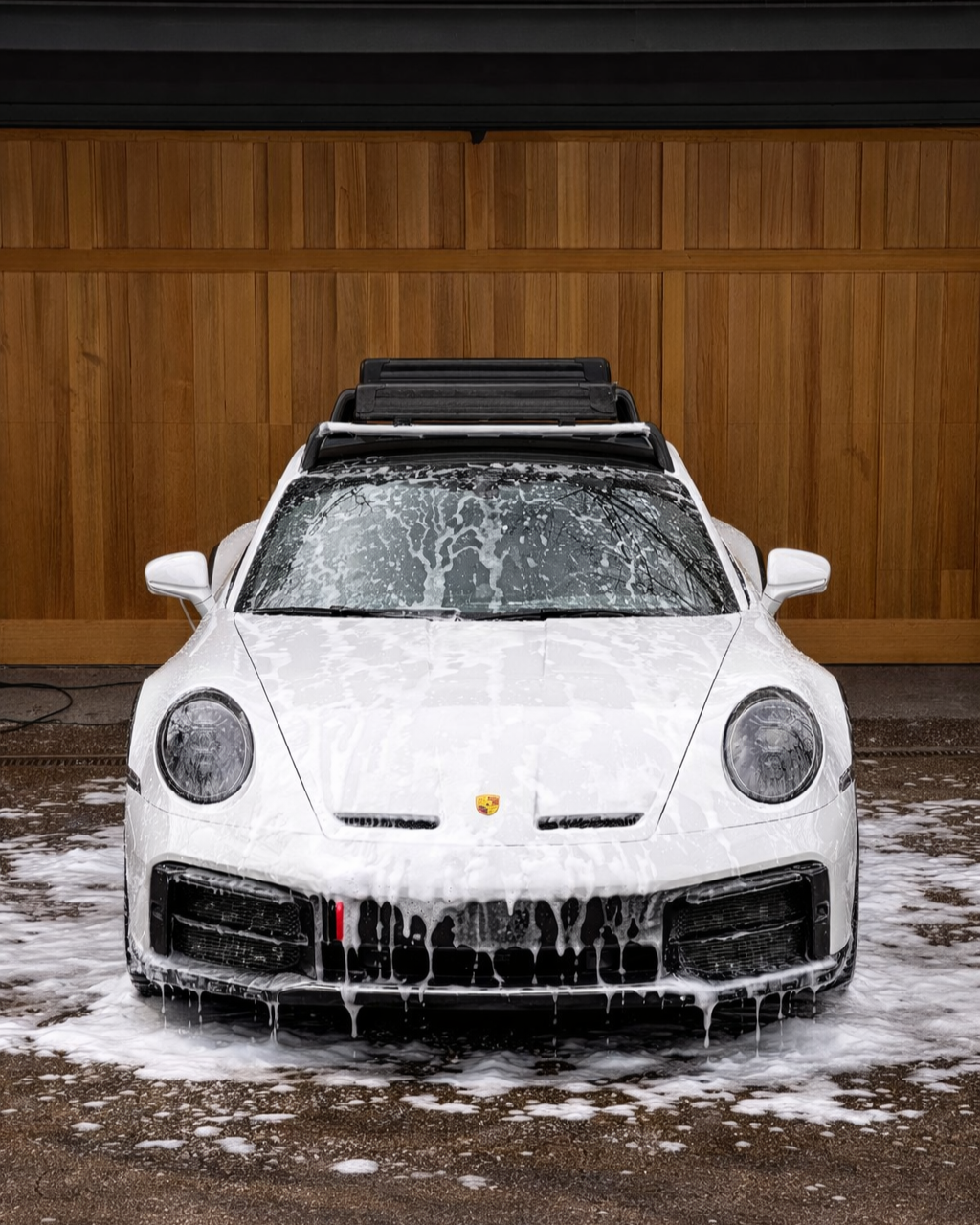 Porsche 911 car detailing service including exterior wash, decontamination, and interior cleaning for a flawless finish.