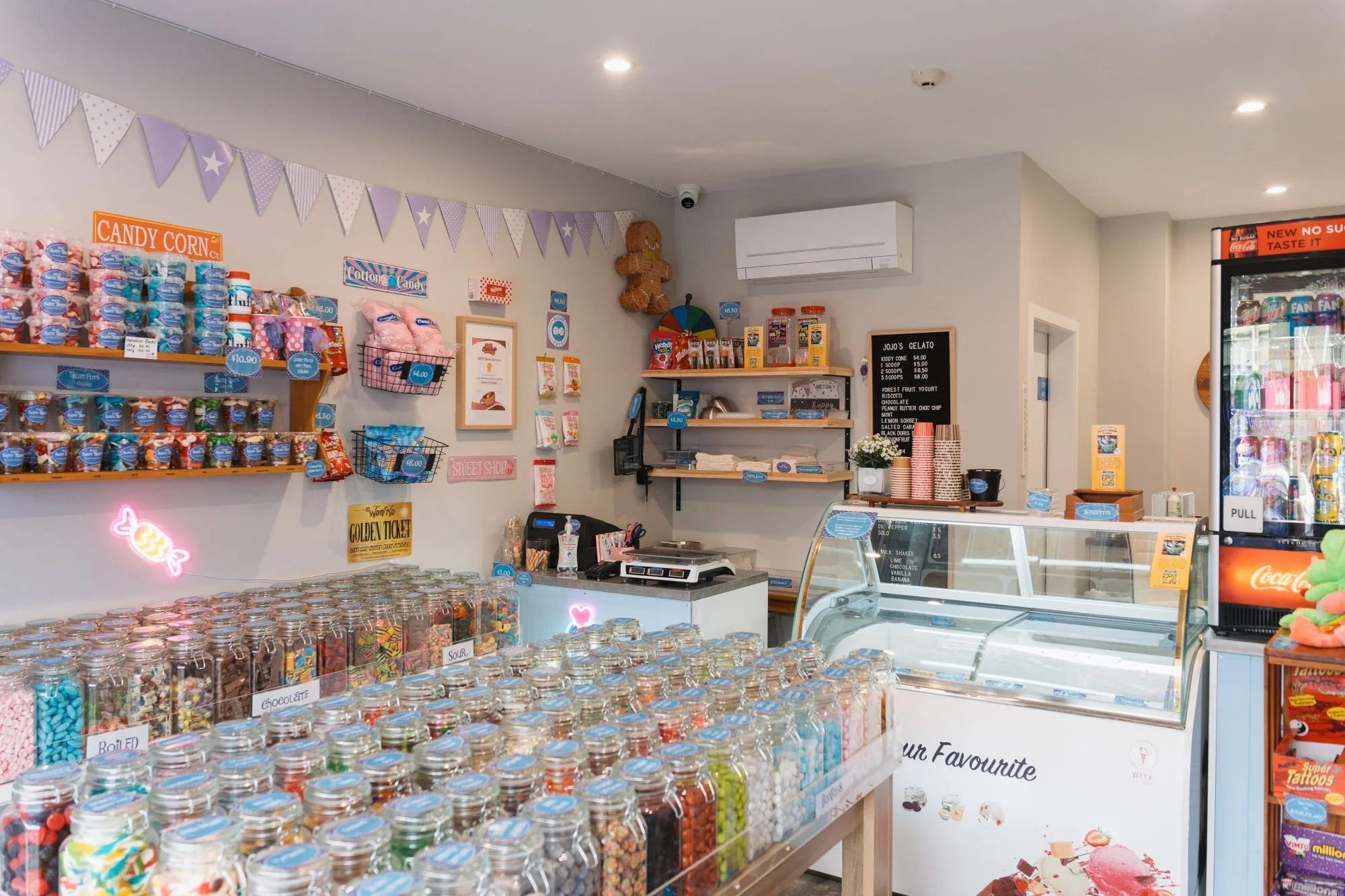 interior image of jojo's  Sweets, shots of filled lolly jars
