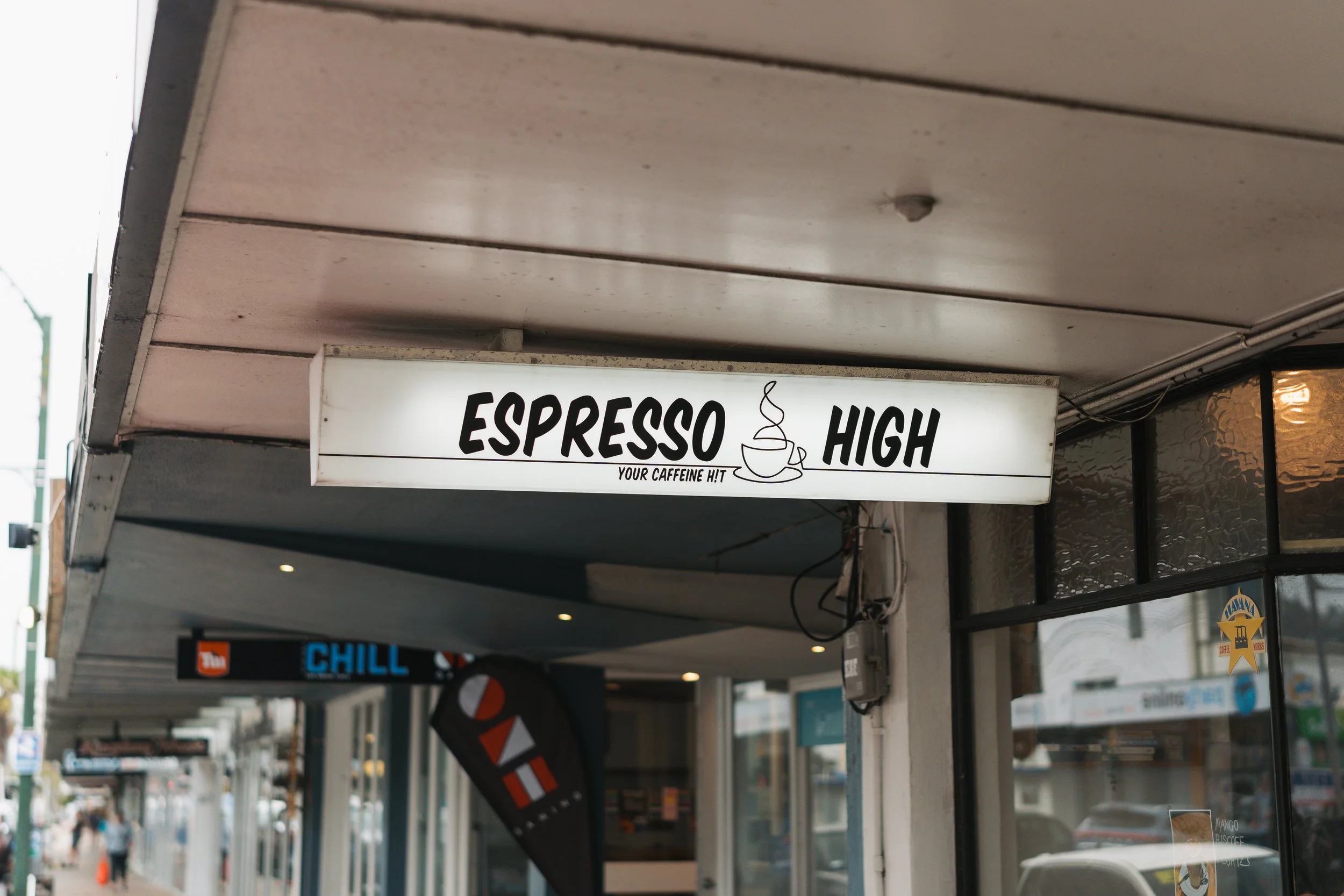 Exterior image of Espresso High's signage, located in Hutt Central