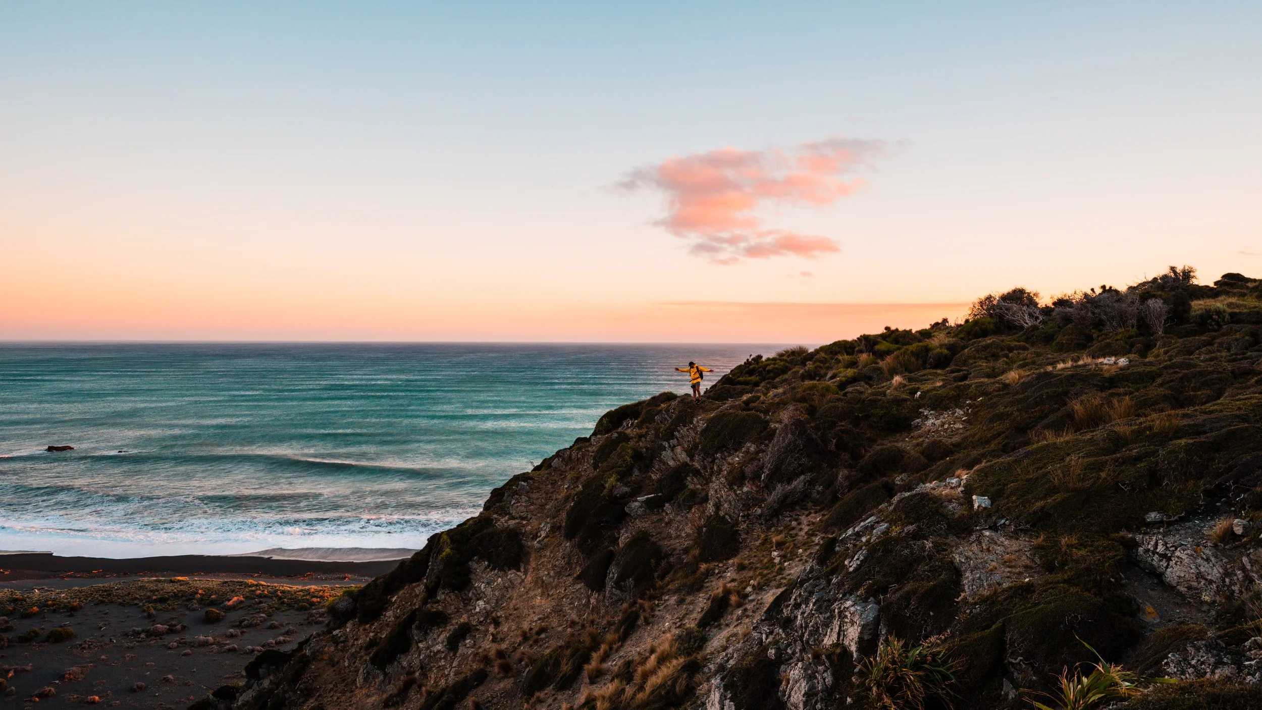 A sunrise image of the hillside at Baring Head, located in Wainuiomata, Wellington NZ