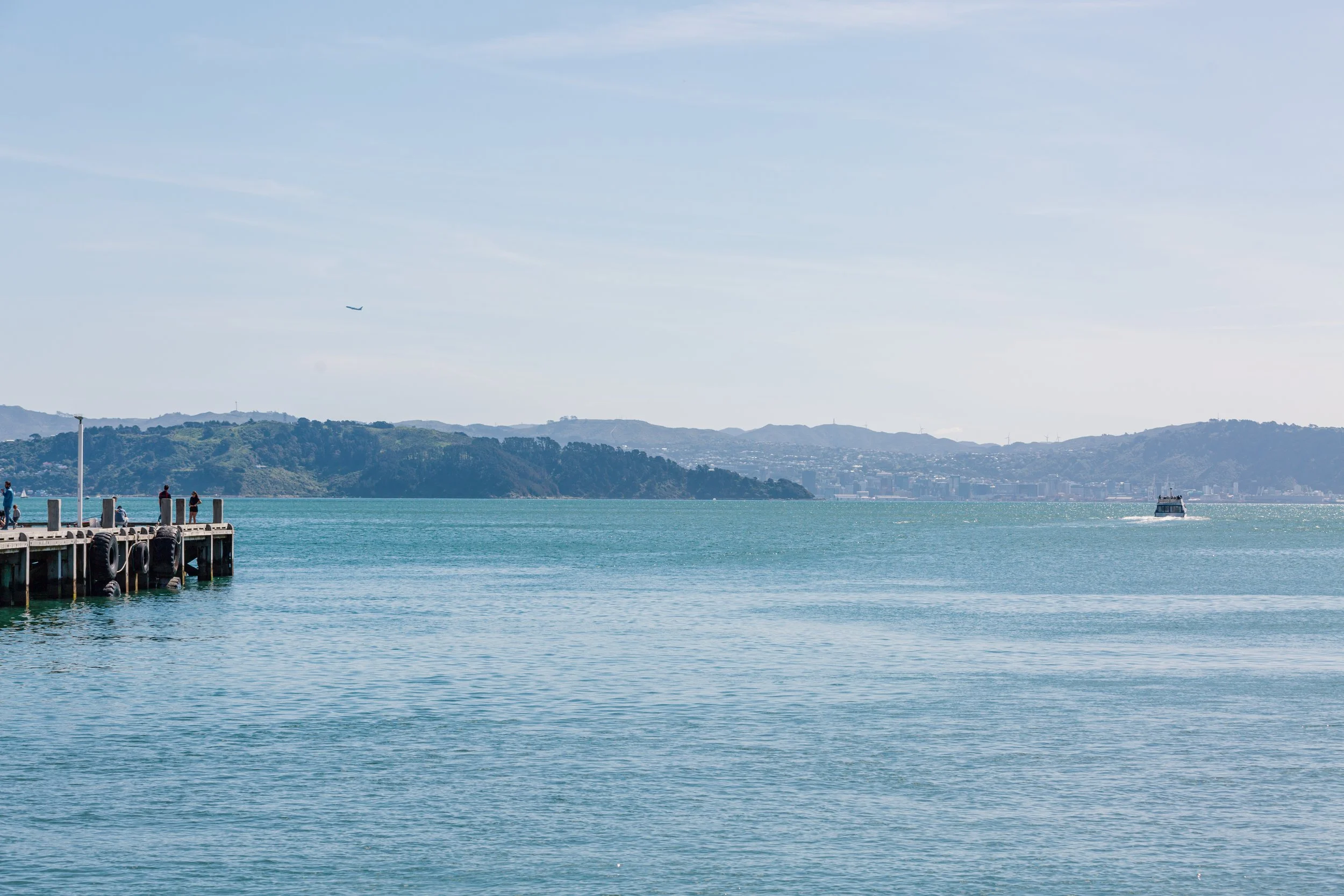 Photo of the water showing the ferry heading towards the Eastern Bays wharf