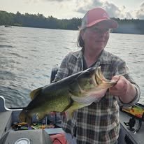 Catching a personal best Largemouth Bass while on a guided fishing charter in Rhinelander Wisconsin