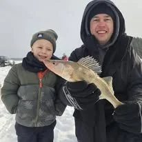 A father son guided ice fishing trip is a great way to make memories with the whole family while catching northern Wisconsin walleye.