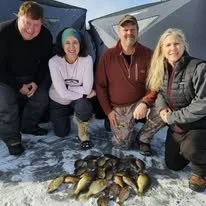 Guided ice fishing trips with heated ice houses are a great way to catch fish while on vacation in Minocqua or St. Germain Wisconsin.