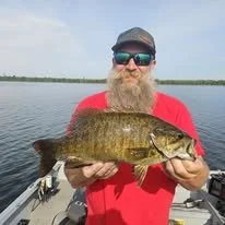 Jason Heindl with Heindls Fishtails Guide service with a trophy smallmouth bass caught on a Rhinelander lake in Wisconsin
