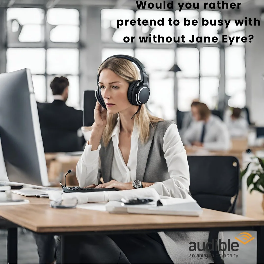 A woman wearing a headset, sitting at a desk in a modern office, looking at her computer screen, with a thoughtful expression.