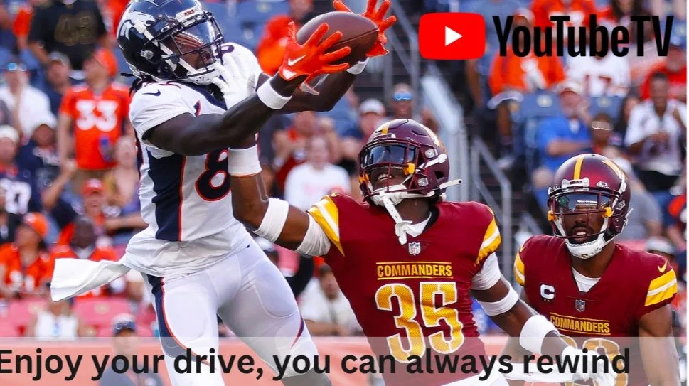 American football game with players in action, a Denver Broncos player catching the ball, surrounded by Washington Commanders defenders on the field with spectators in the background, and a YouTube TV logo at the top right.