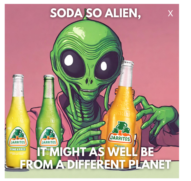 Cartoon green alien with large black eyes holding a bottle of mango-flavored Jarritos soda, with two other bottles of pineapple and lime-flavored Jarritos soda in front. The background is pink, and the text reads "Soda so alien, It might as well be f