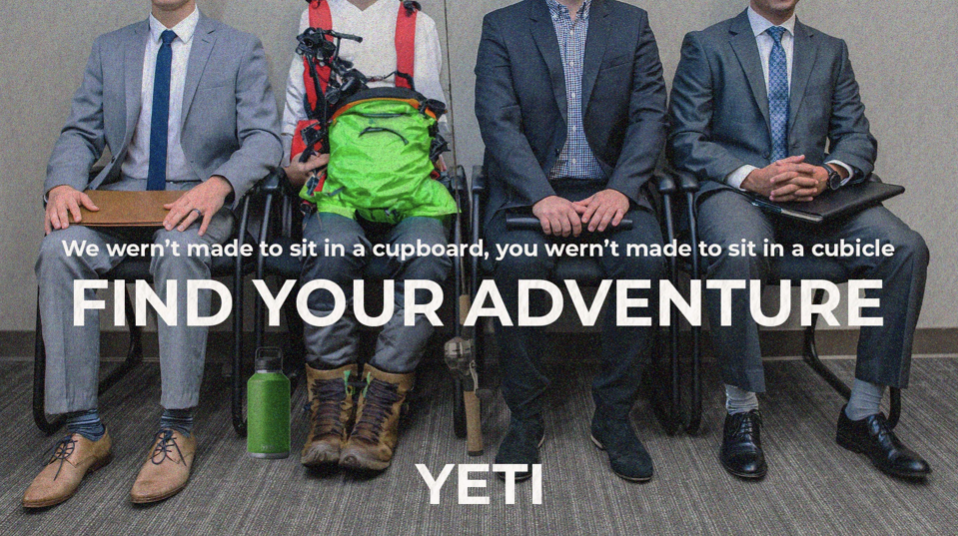 Four men in business suits sitting in a row at a press conference or event. One man has a green backpack and hiking boots. A green water bottle is on the ground in front of him. Text on the image reads: "We weren’t made to sit in a cupboard, you were