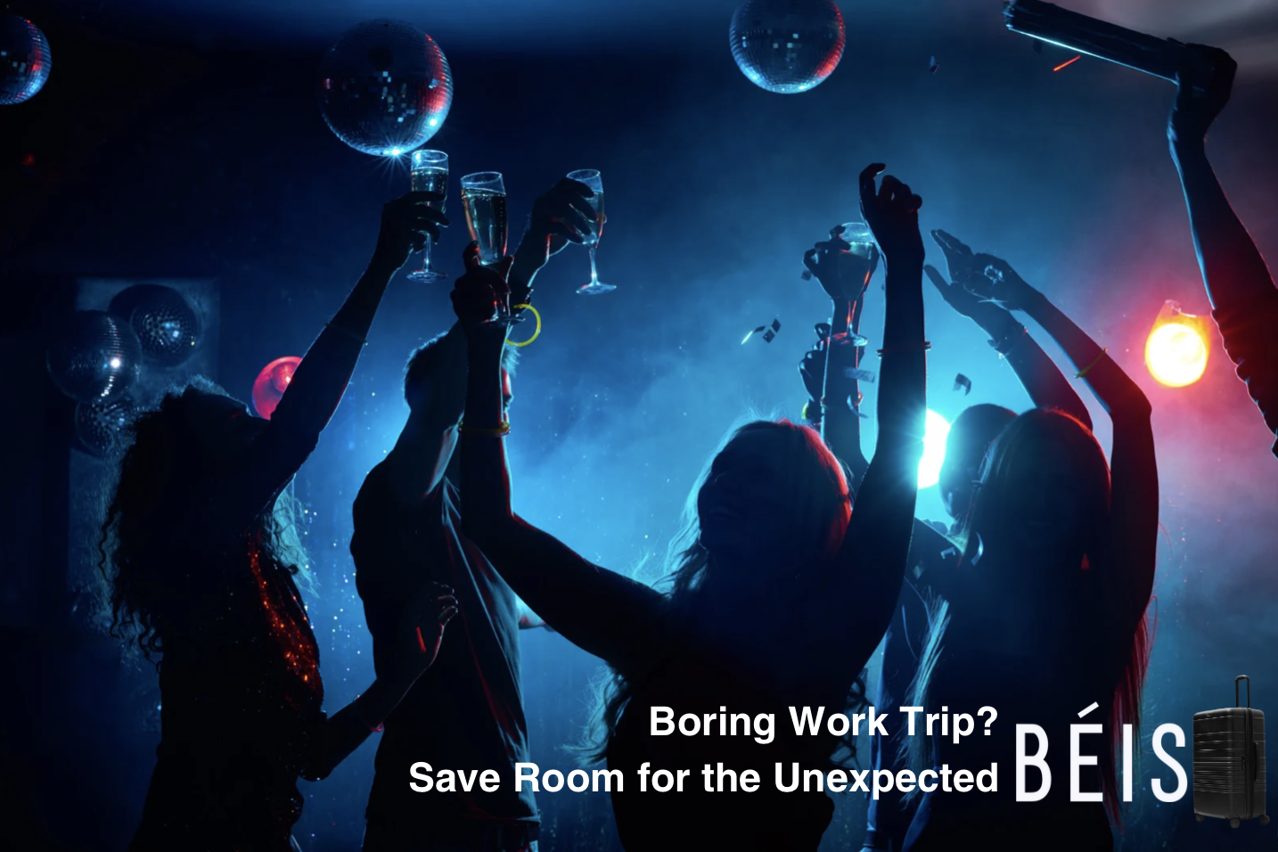 People dancing and celebrating with drinks in a nightclub with disco balls and colorful lights.
