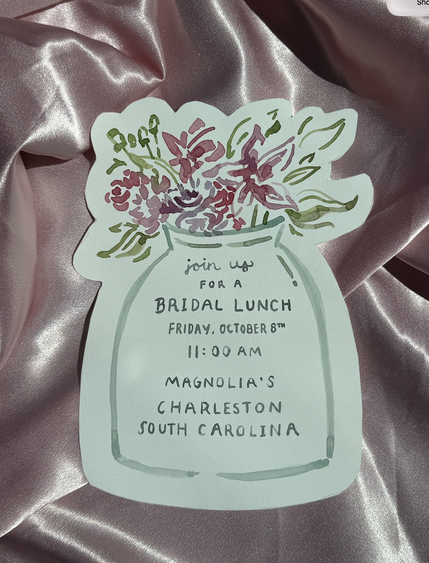 Invitation to a bridal lunch featuring a floral illustration in a vase, with event details written in black ink on light-colored paper.