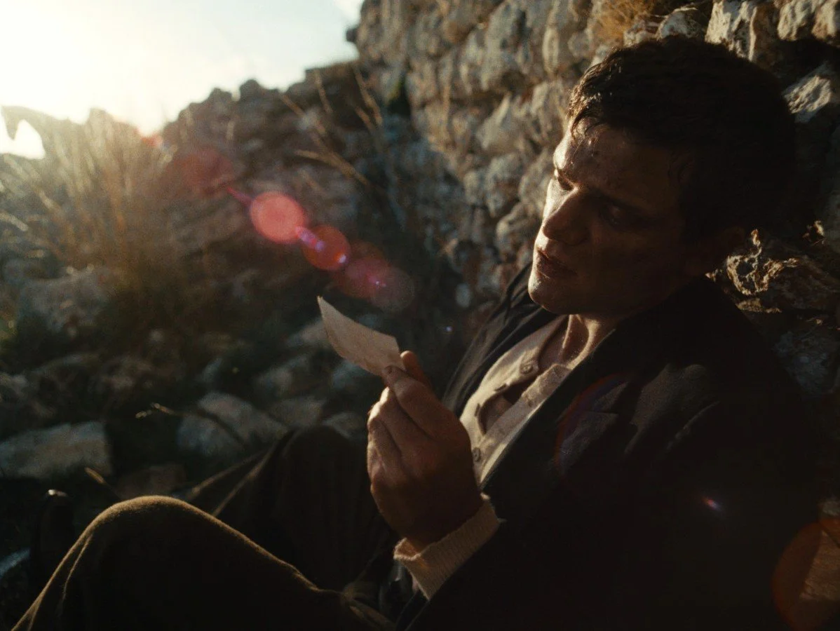 Jacopo Olmo Antinori seated on a rock in Visions of Loss