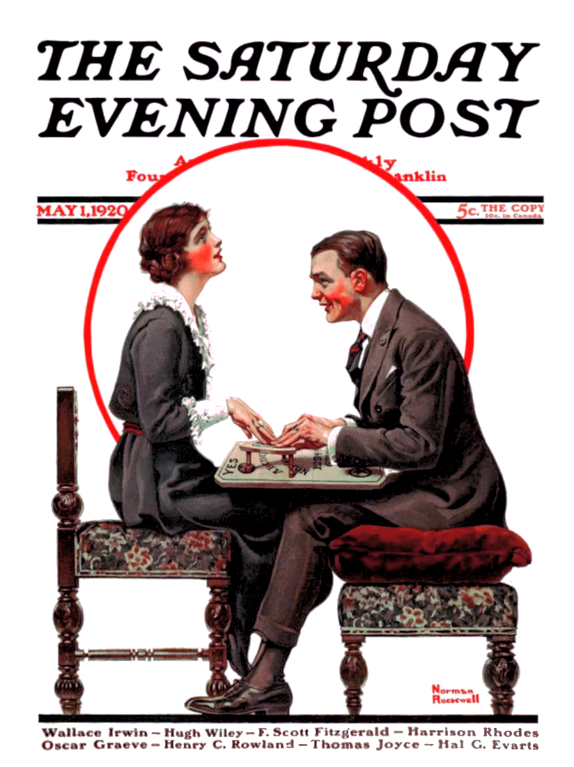 A man and women manipulate a Ouija board while they sit.