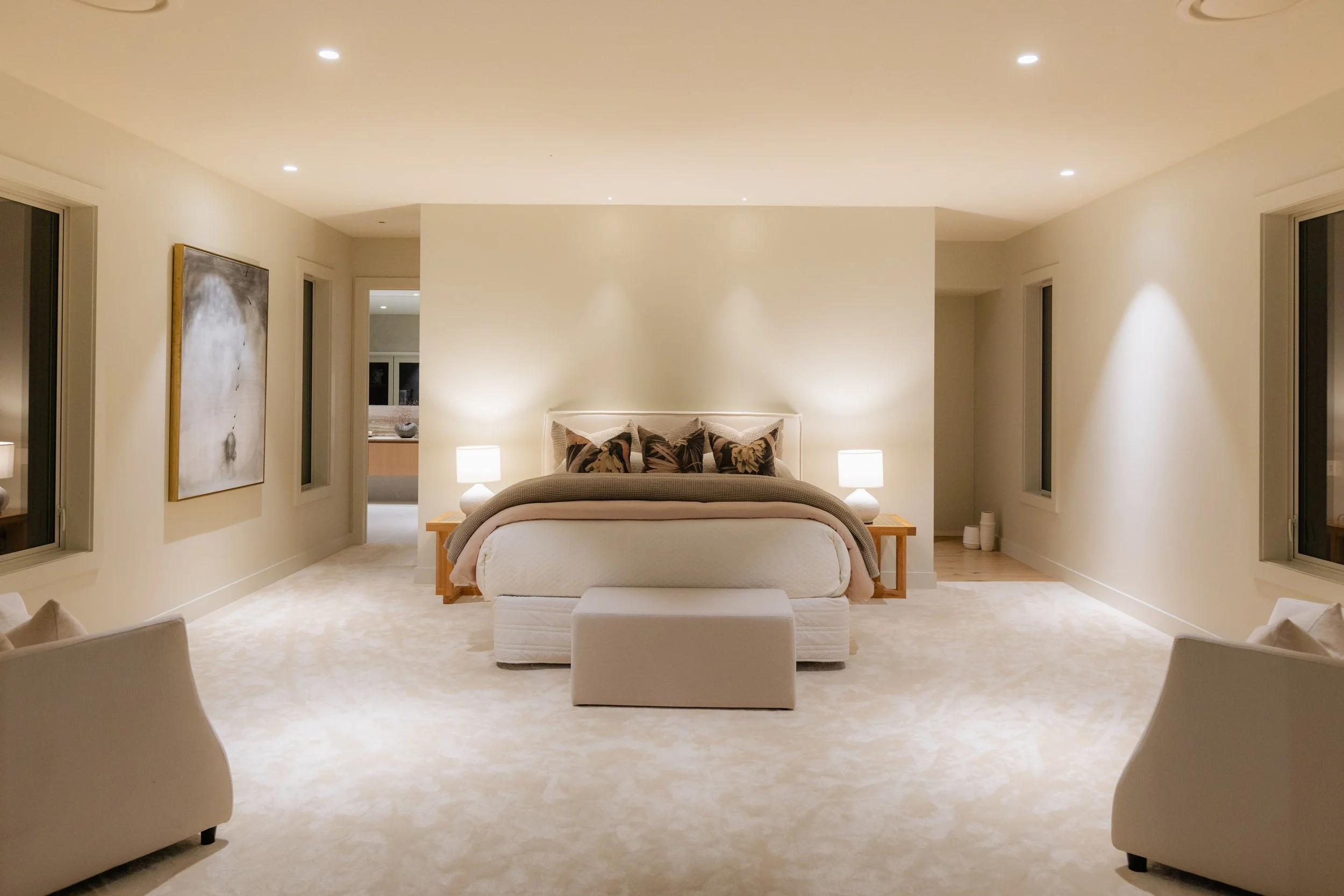 Primary suite within a luxury St Heliers home, Auckland Eastern Bays, featuring architectural scale, soft ambient lighting, and refined finishes. A private retreat designed for comfort, balance, and elevated living.