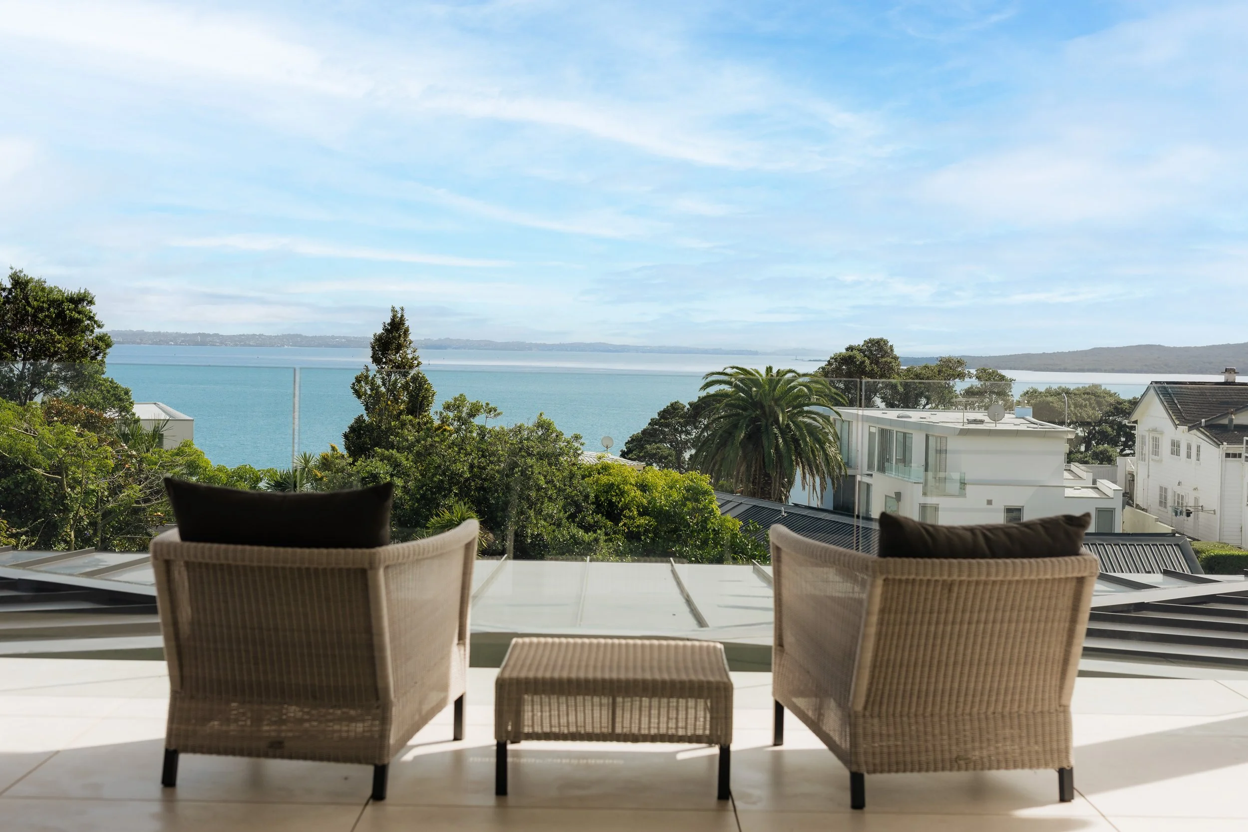 Private master suite balcony with elevated sea views in a luxury St Heliers home, Auckland Eastern Bays. A refined outdoor living space capturing coastal outlooks and seamless indoor-outdoor connection.