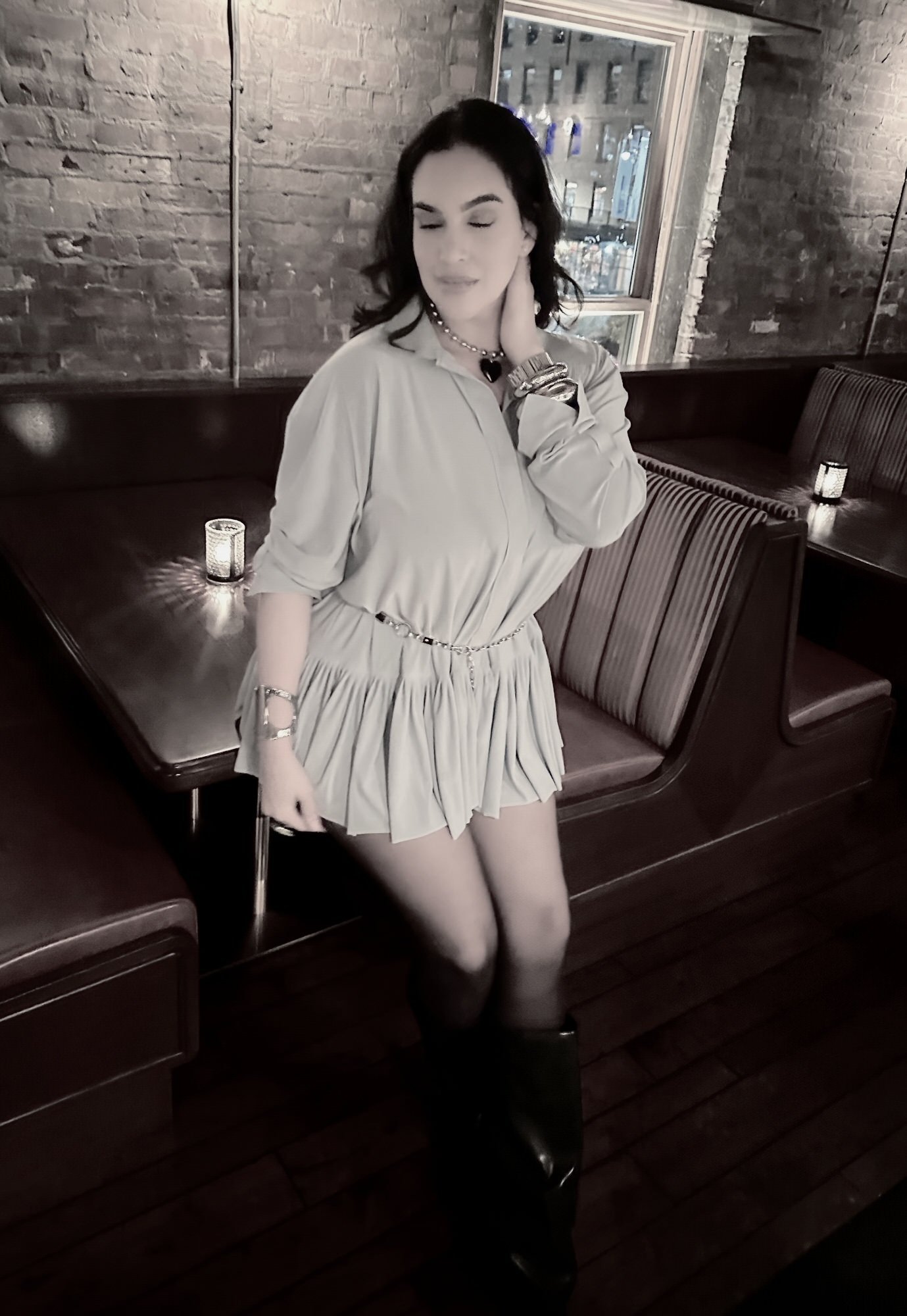 Dariana Casado - leaning against a table hand on back of neck/head in dress