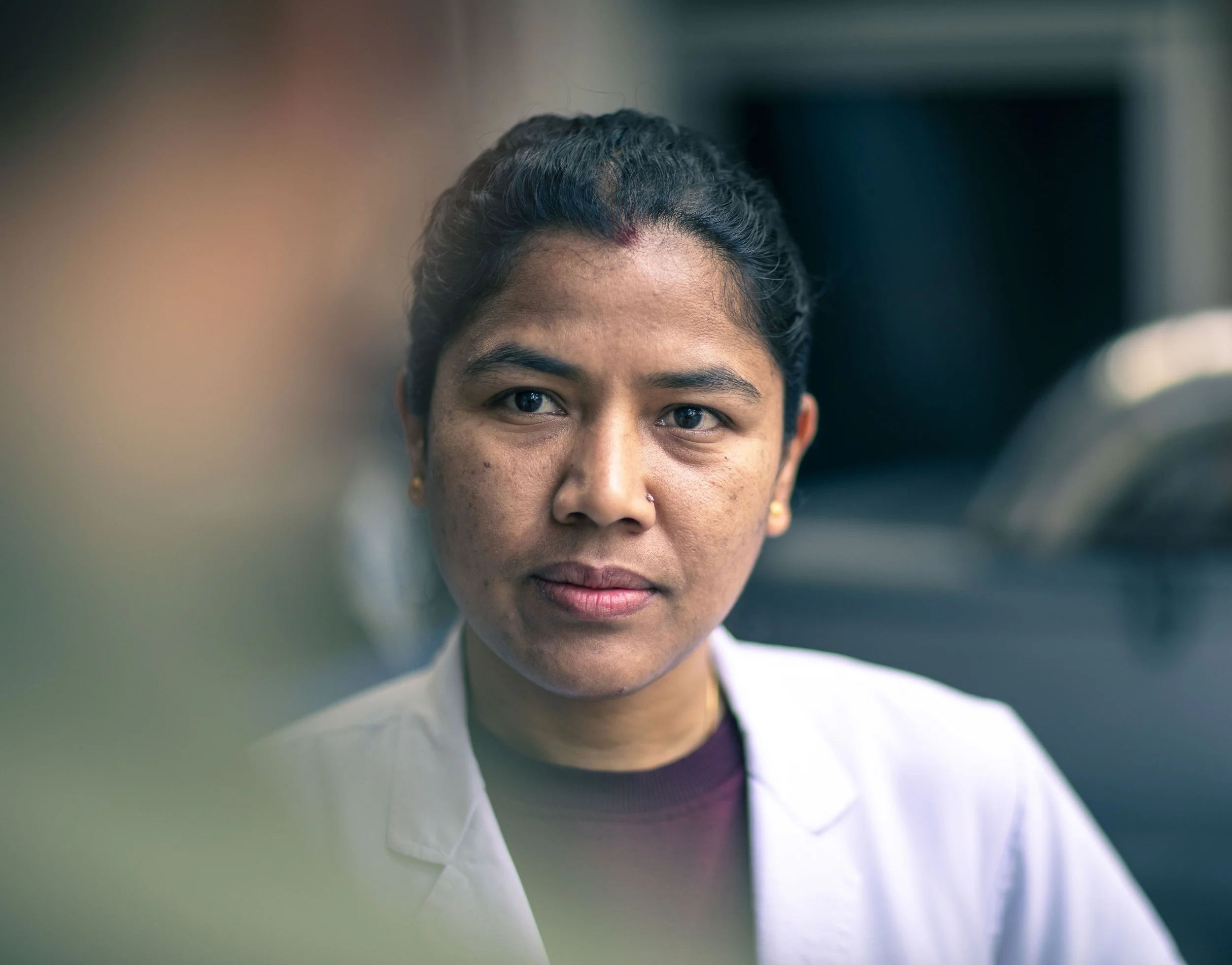 young Nepalese female emergency room doctor portrait Tilganga Eye Institute Kathmandu Nepal Simon Shattky
