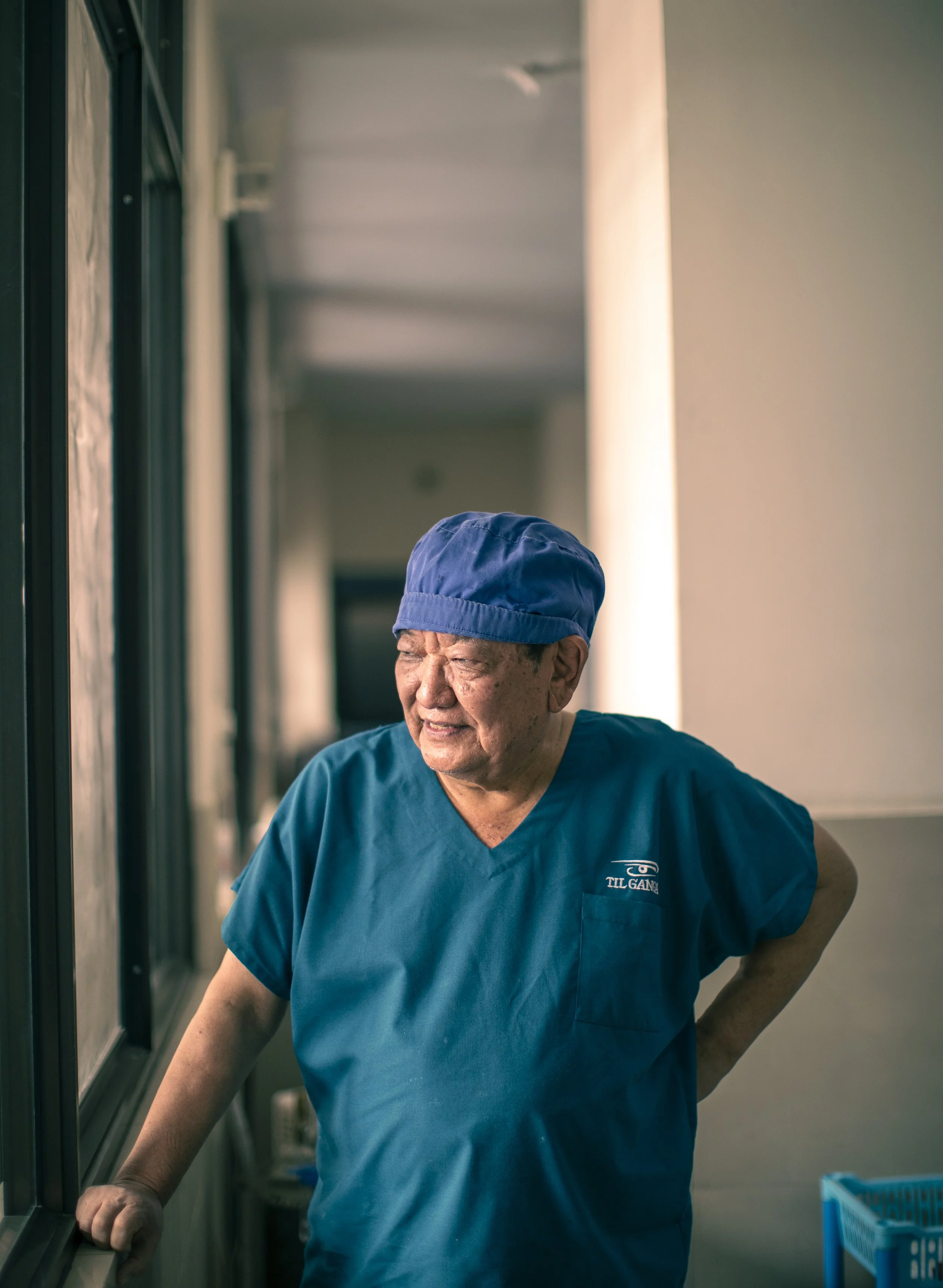 Dr Sanduk Ruit portrait surgical scrubs outside operating theatre Tilganga Eye Institute Kathmandu Nepal Simon Shattky
