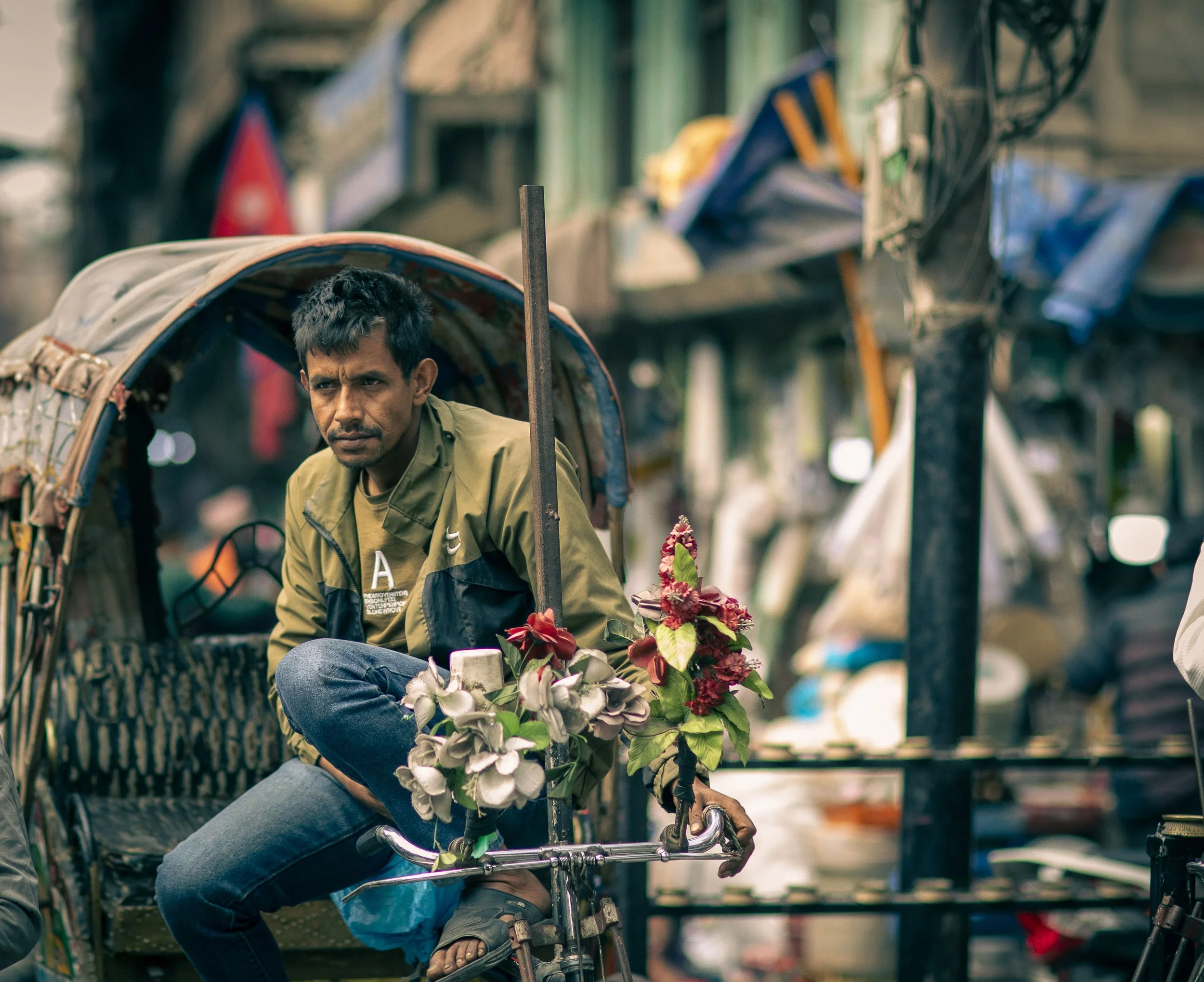 Candid portrait rickshaw driver street scene in Thamel, Kathmandu by Simon Shattky
