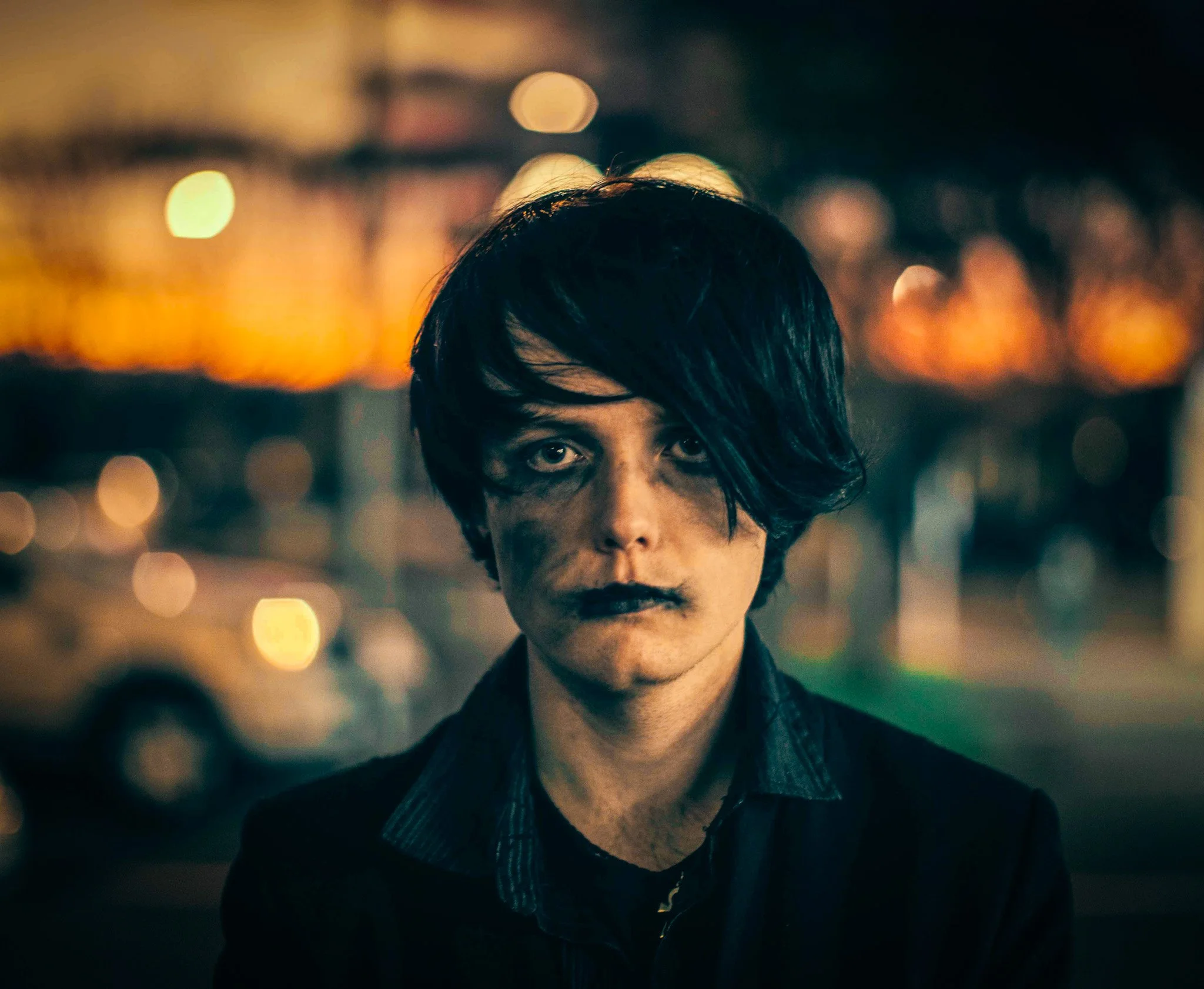 Editorial portrait young goth man wearing black make up. dramatic lighting Auckland photographer Simon Shattky
