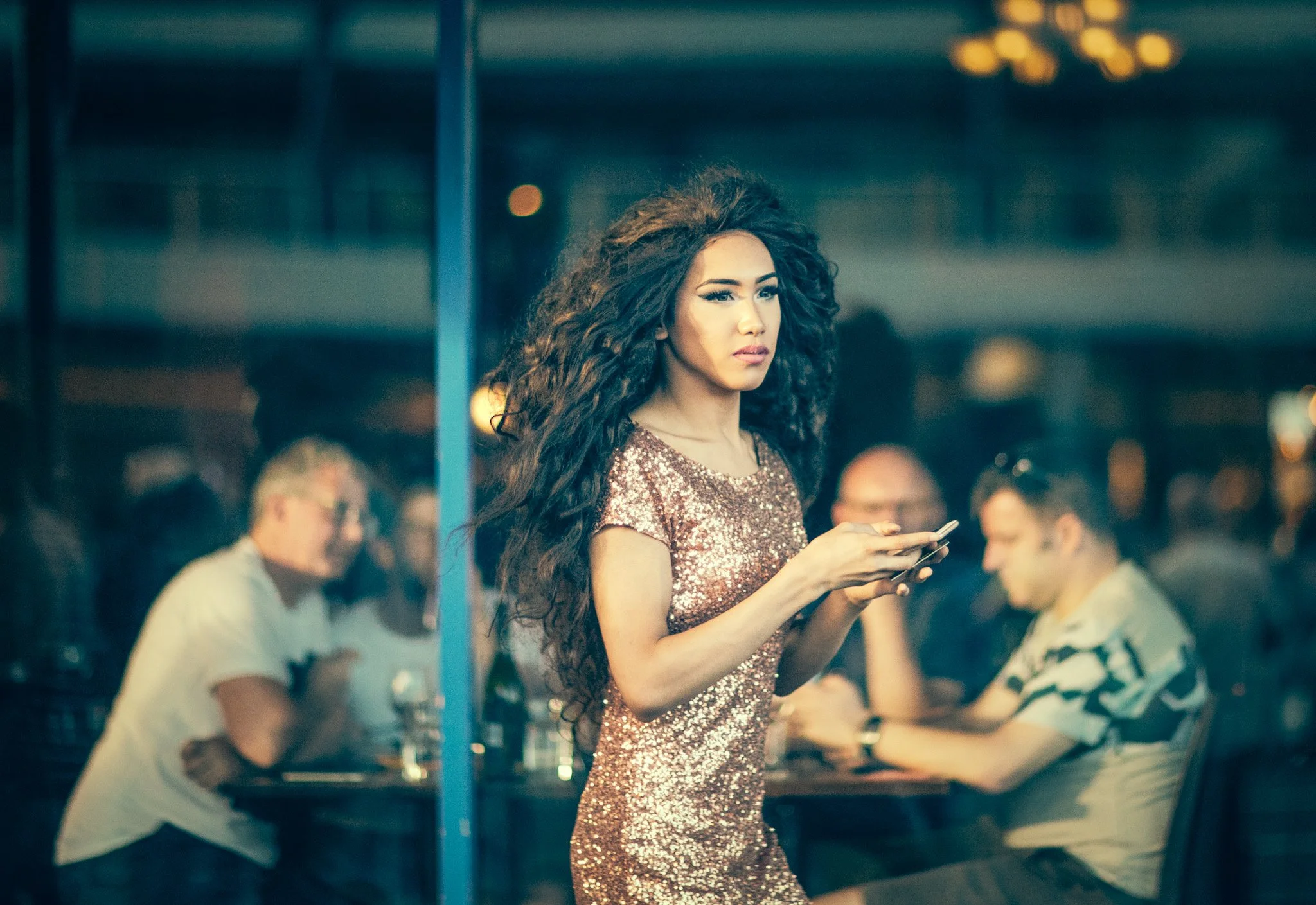 Candid portrait young woman sequin dress outside Ponsonby restaurant pride parade by auckland photographer Simon Shattky
