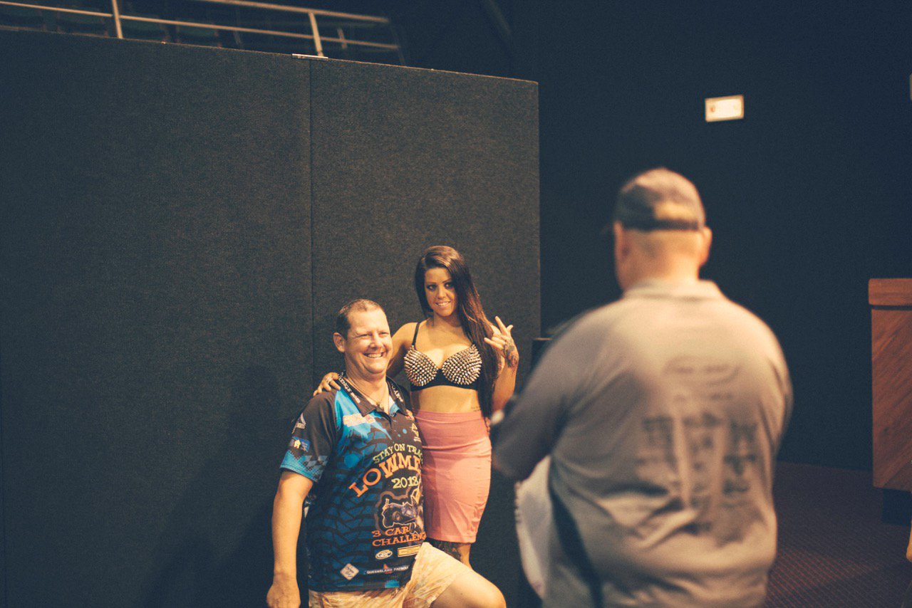 Candid portrait woman and man posing for photo at lo-riders national champs Simon Shattky
