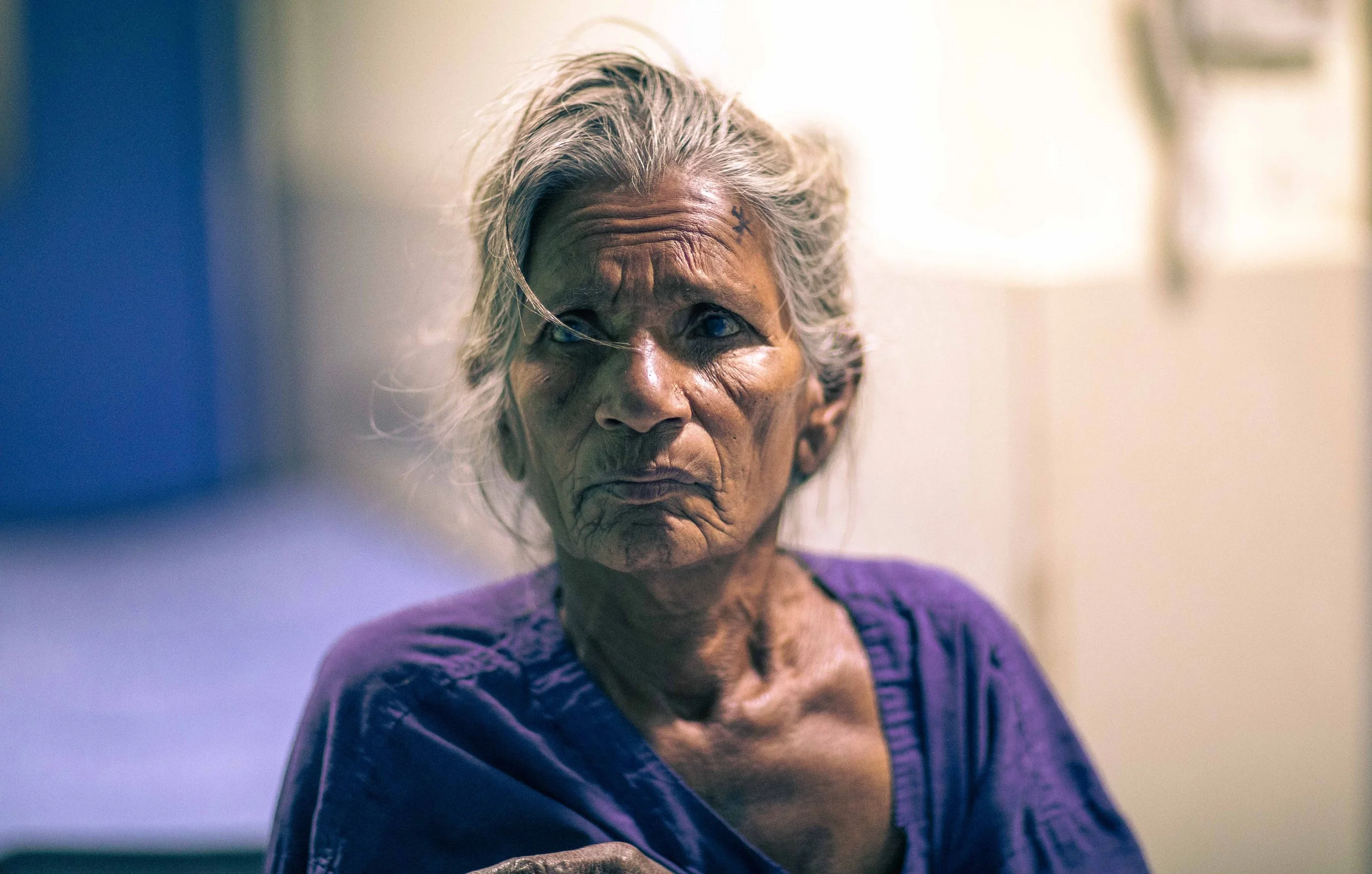 Elderly Nepalese woman cataract patient awaiting surgery portrait Tilganga Eye Institute Kathmandu Nepal Simon Shattky
