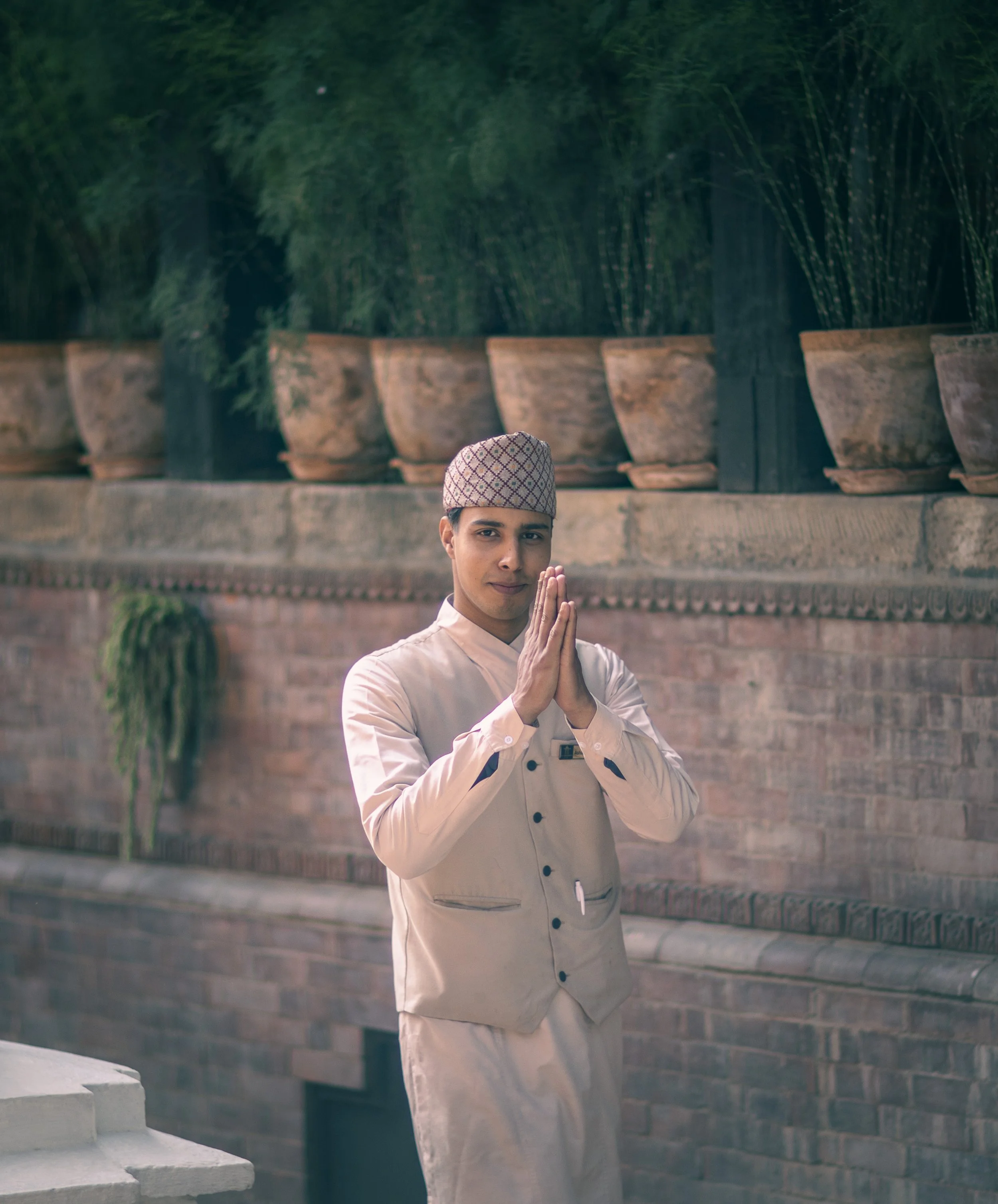 Editorial portrait waiter at the Dwarikas namaste gesture Nepal Kathmandu Simon Shattky
