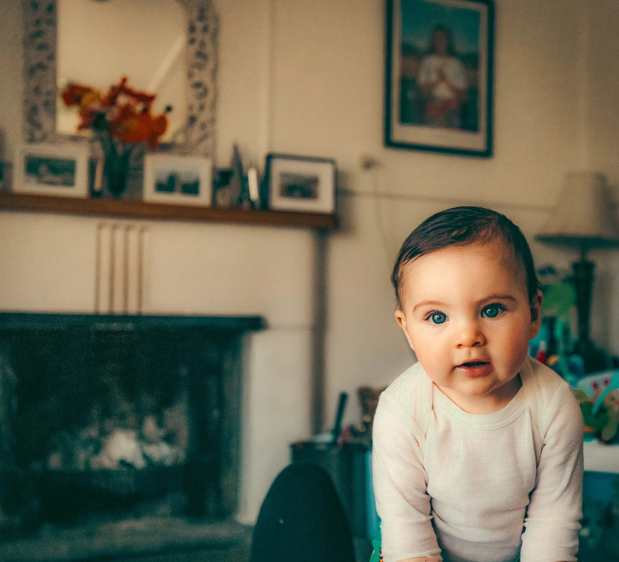 Young toddler in lounge soft light candid portrait Simon Shattky
