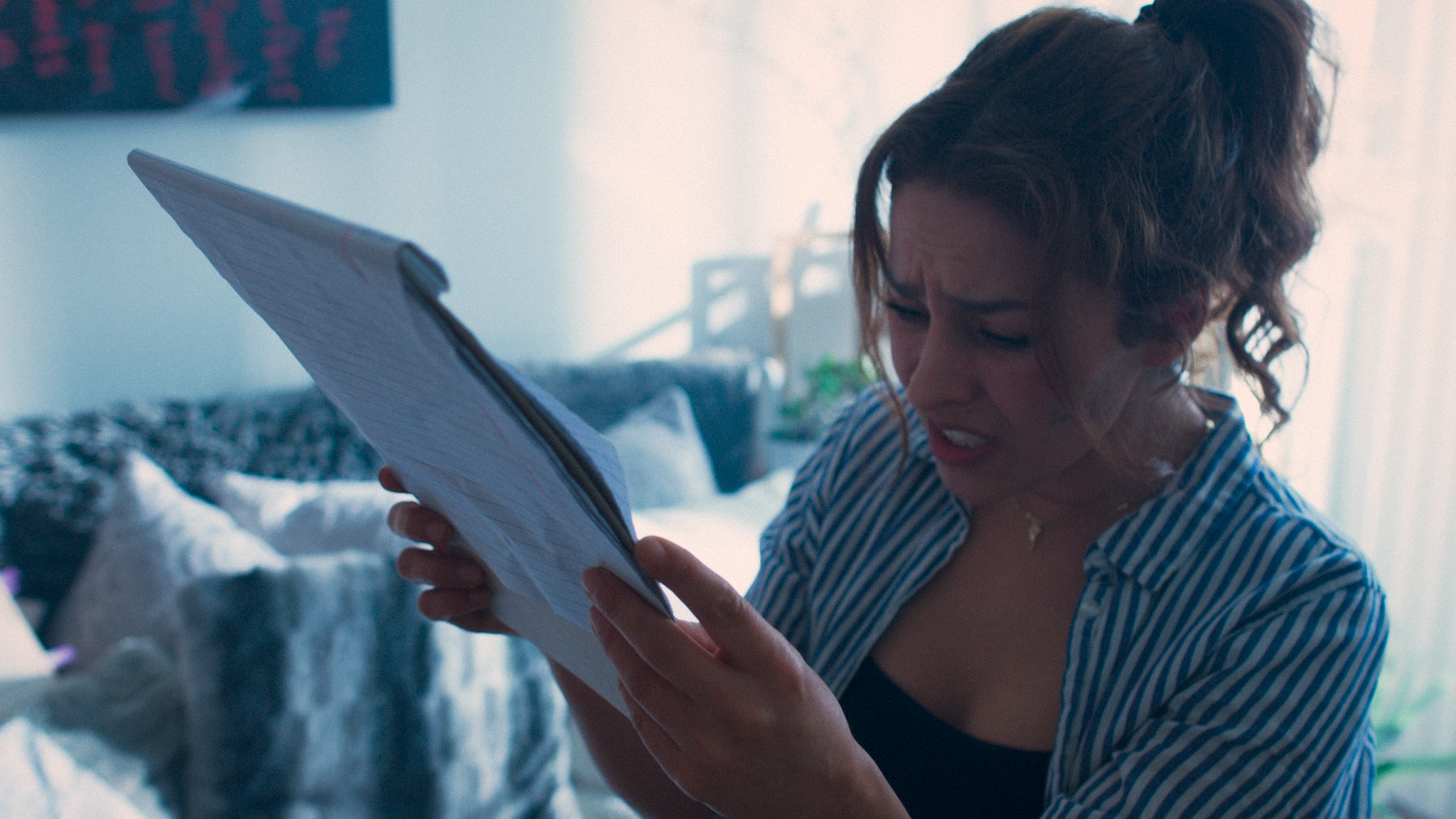NINA LOOKING AT NOTES 4.2.png