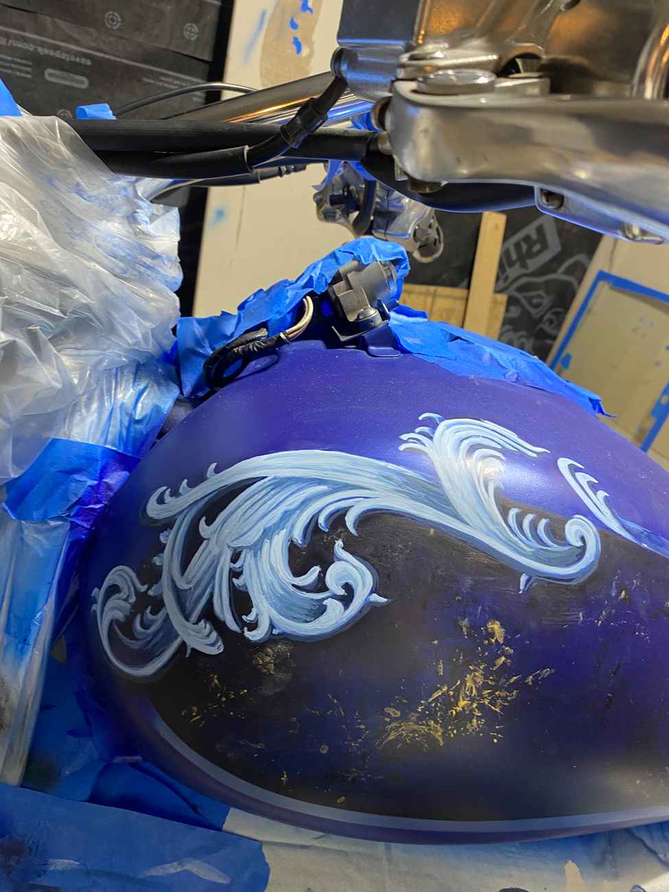 Custom motorcycle fuel tank airbrush paint wave design in progress Sioux Falls SD