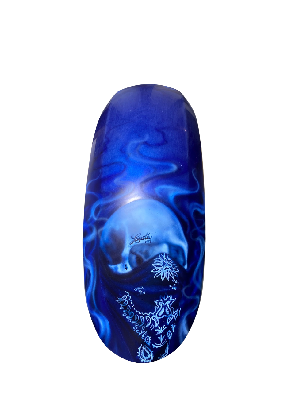 Custom airbrush skull artwork on motorcycle part with blue smoke effects and bandana detail