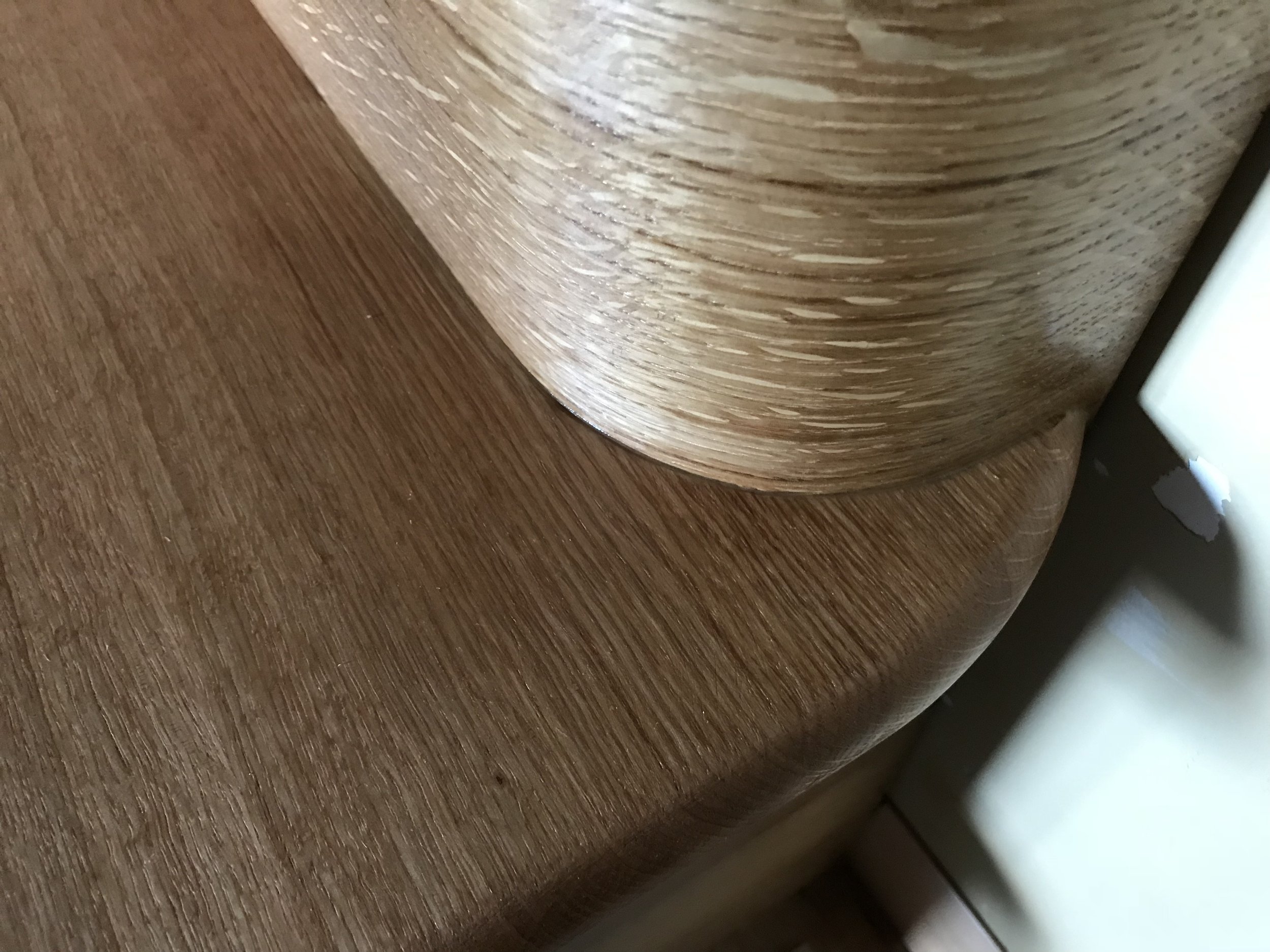 Ark Built Carpentry custom wooden staircase with rounded edges, custom curved wood and smooth, polished finish.