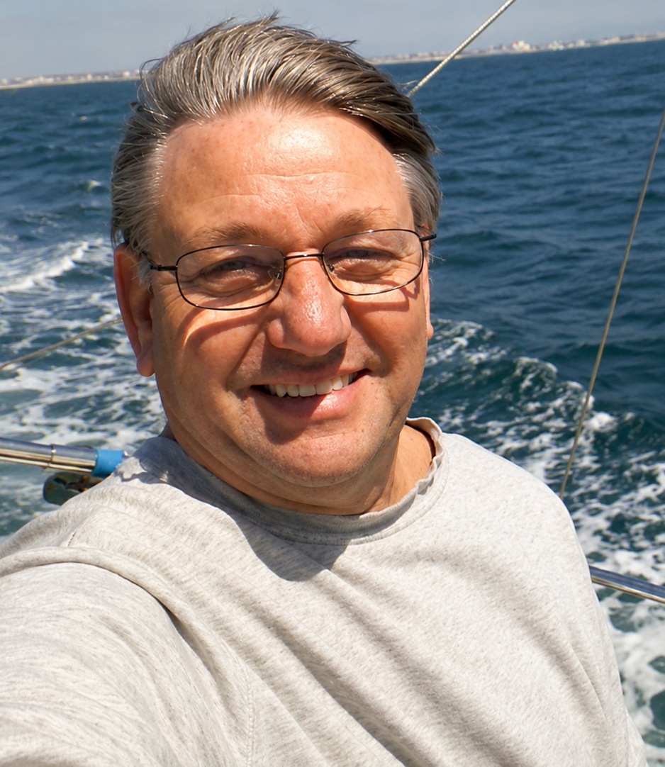 P.J. Palms, author of Piggery Adventure Tales, aboard a sailboat, reflecting a lifelong love of adventure, exploration, and storytelling.