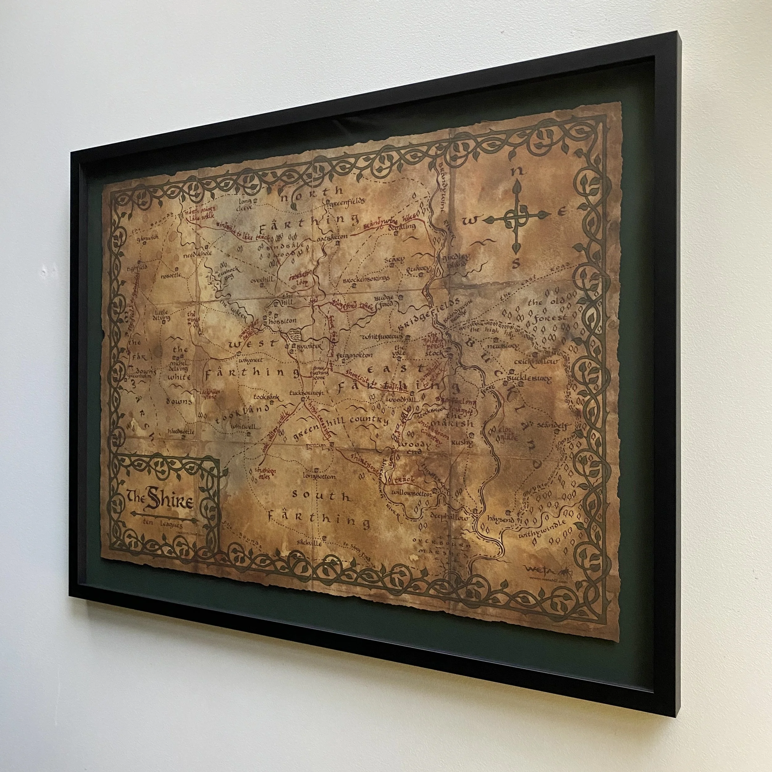 Weta Cave 'The Shire' print framed by Eyeball Kicks