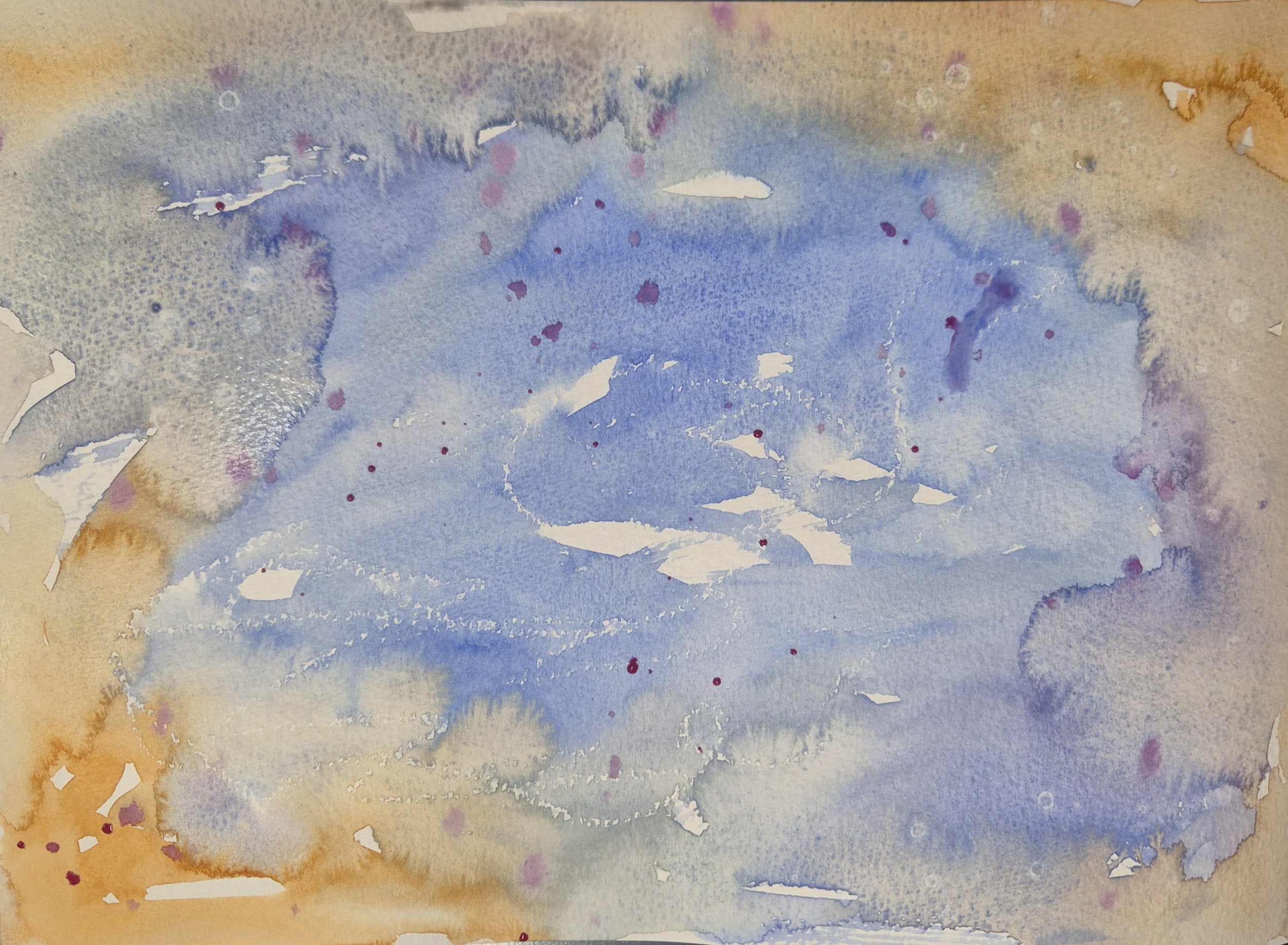 A creative wash in watercolour with blue, purple and oranges swirling together on the page