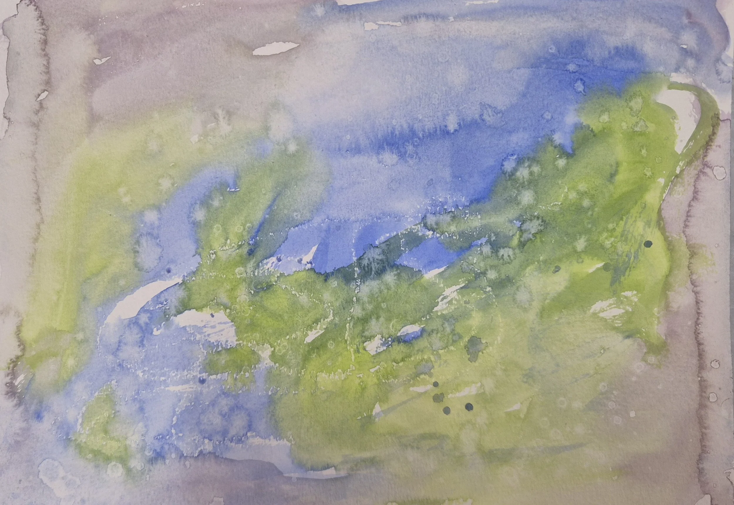 A 'creative wash' in watercolour, with greens, blues and purples swirling together on the page.