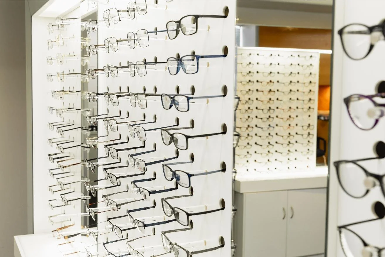 pairs of glasses displayed at an optometrist