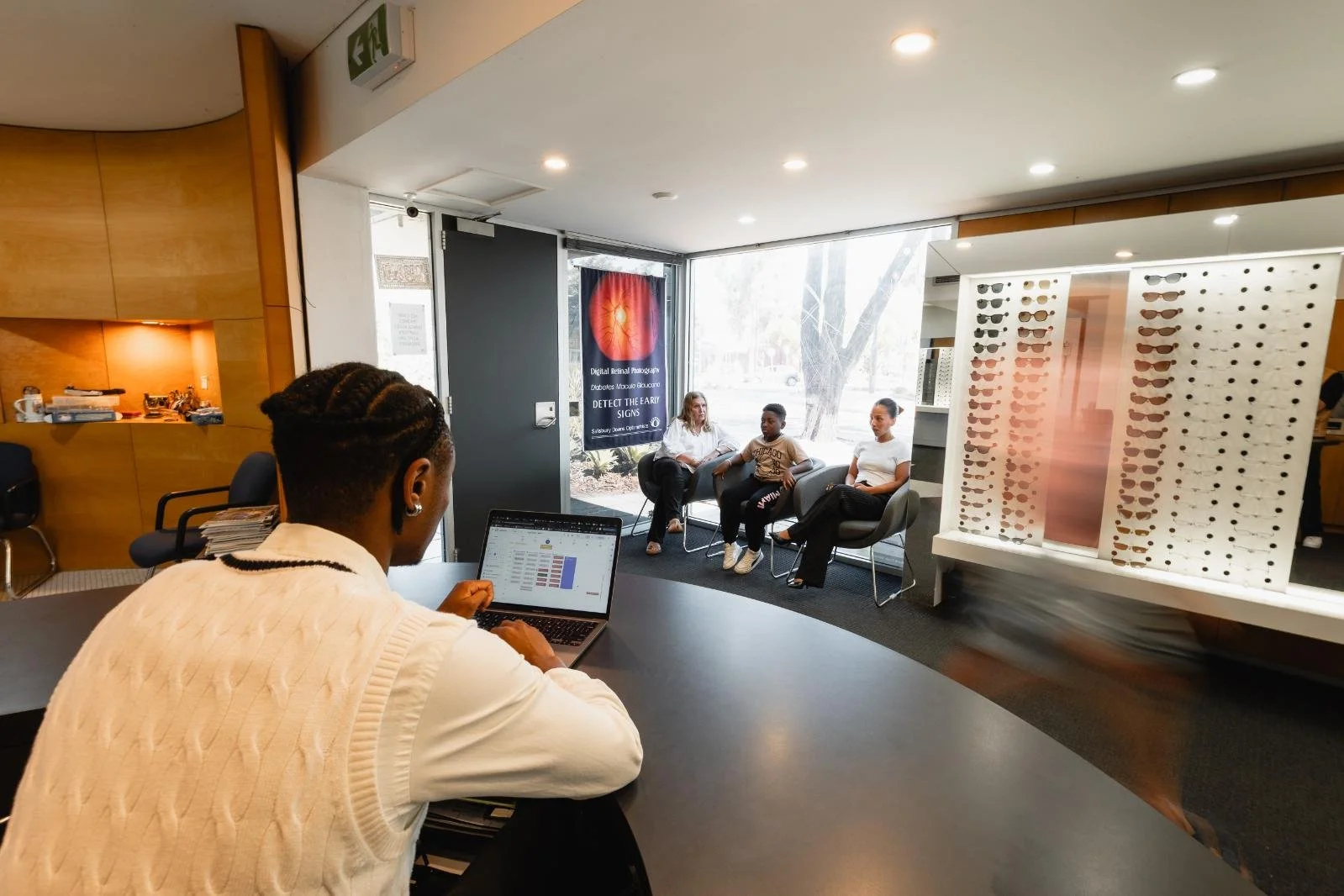 people waiting in an optometrist waiting room