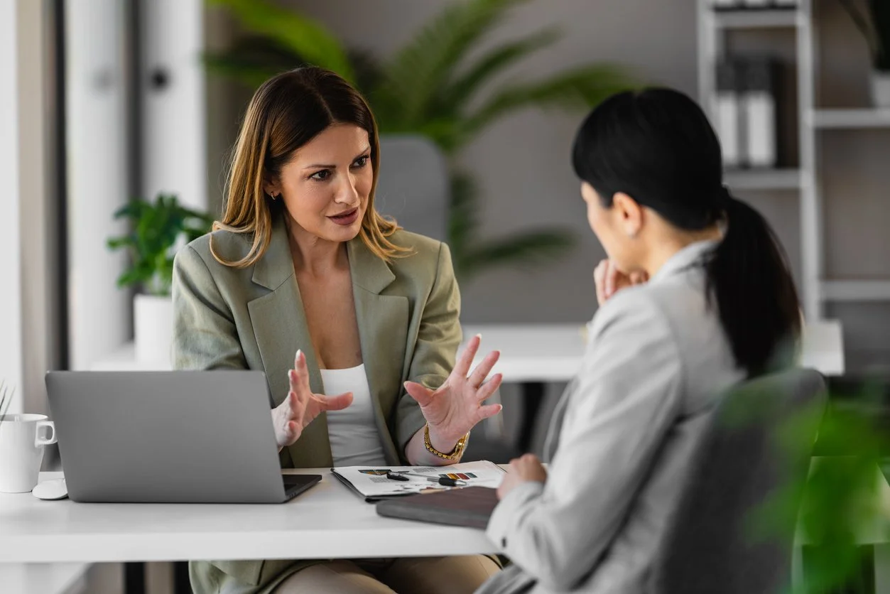 Two business women working together