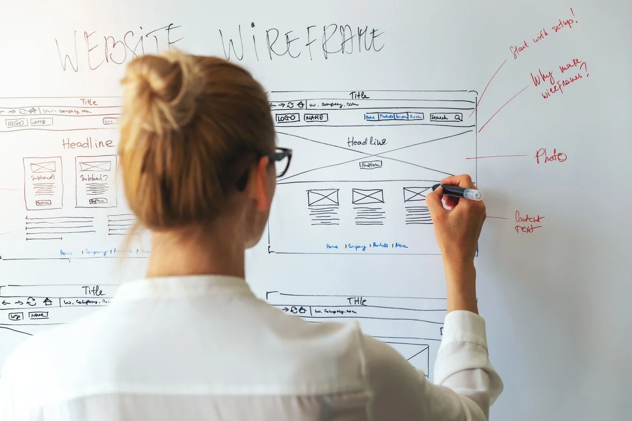 Woman designing website wireframes
