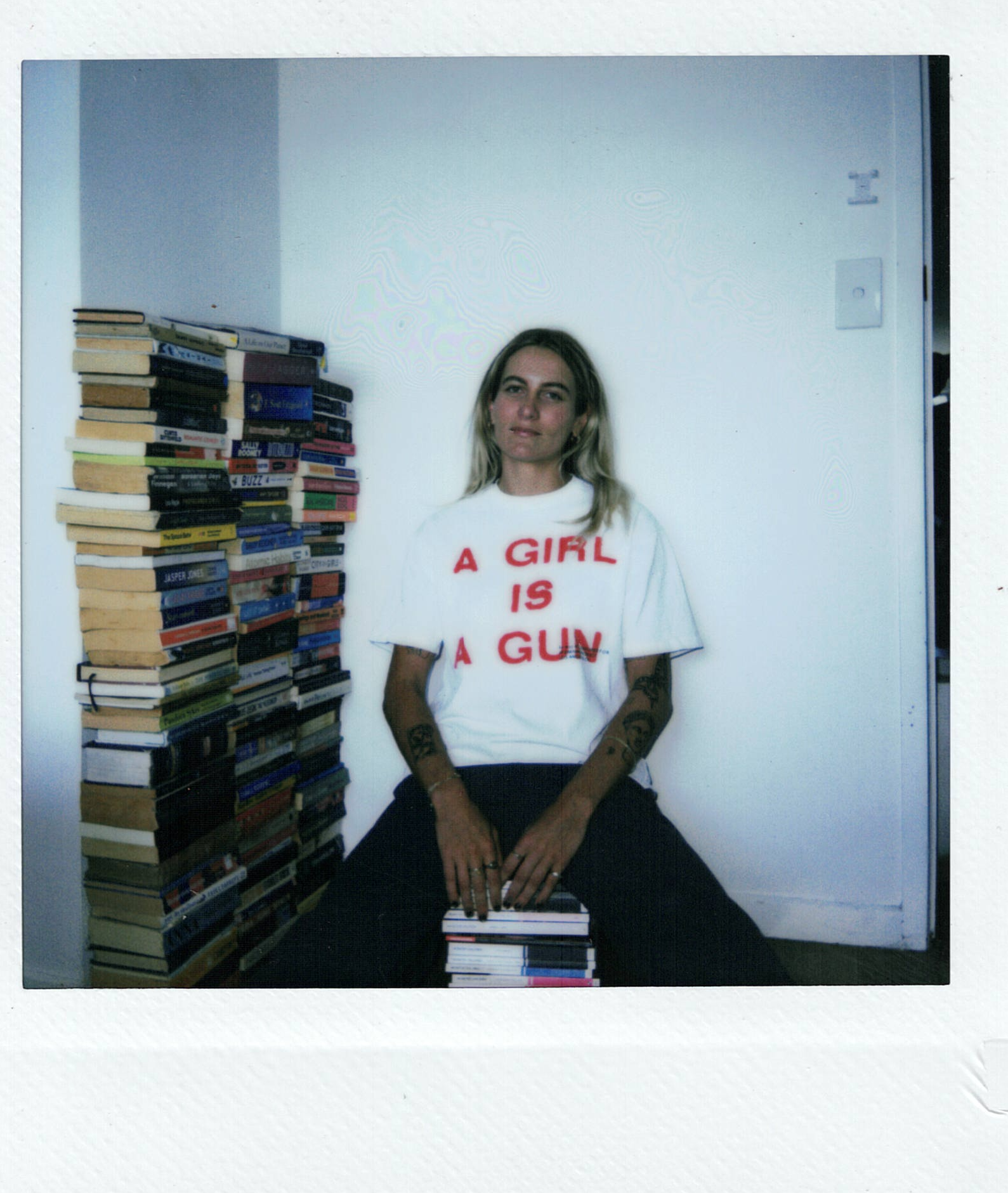 Portrait of Sam Hetherington with her books.