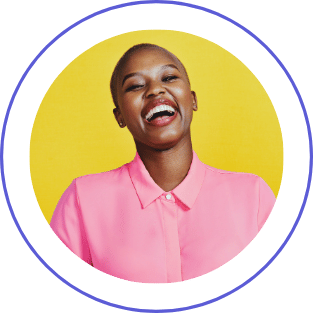 A smiling woman with short hair, wearing a pink button-up shirt, against a yellow background.