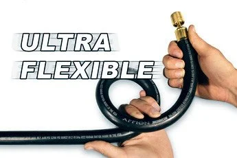 A person holding a flexible black garden hose with brass nozzle, with the words 'Ultra Flexible' in bold white letters.